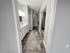 Elegantly designed bathroom with modern cabinetry, mirrored closet doors, and ambient lighting.
