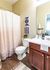 Contemporary bathroom featuring a stylish vanity, modern decor, and inviting shower area.