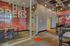 Vibrant campus lounge area with modern seating and bold graphics on the walls.