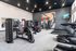 Sleek modern gym with state-of-the-art fitness equipment and vibrant mural art.
