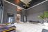Sophisticated lobby with modern decor, featuring dark patterned walls, stylish lighting, and plush seating.