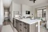 Modern kitchen with a sleek island, open layout, and elegant decor, perfect for contemporary urban living.