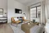 Contemporary living room with modern furniture, large window, and stylish decor.