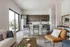 Modern open-concept kitchen and living room with stylish furnishings and natural light.