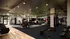 Spacious and modern gym with state-of-the-art equipment and natural light.