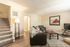 Inviting living room with modern furniture, warm lighting, and stylish decor.