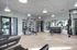 Modern gym with state-of-the-art equipment, featuring strength machines, free weights, and a stylish design.