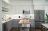 Modern kitchen with sleek gray cabinets, stainless steel appliances, and a stylish wooden island in a bright, open space.