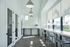 Bright, modern office space featuring sleek furniture, large windows, and stylish lighting for a productive environment.