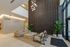 Elegant, modern lobby featuring a chic seating area, soft beige tones, and lush indoor plants.
