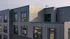 Modern apartment exterior showcasing sleek architectural design with large windows and balcony views.