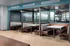 Modern dining area with stylish booths, sleek tables, and elegant decor offering a cozy and inviting ambiance.