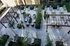 Chic outdoor terrace with elegant seating, lush greenery, and stylish pergolas, perfect for relaxing and entertaining.