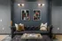 Chic modern living room with elegant black leather sofa, abstract art, and ambient lighting creating a sophisticated ambiance.