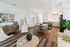 Bright and inviting living room with modern furniture, stylish decor, and an open kitchen design, perfect for entertaining.