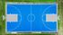 Vibrant blue outdoor basketball court with lush green surroundings, featuring clear boundary lines and dual hoops.