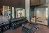 Modern fitness center with a range of free weights, exercise benches, and sleek gym equipment in a bright, spacious layout.