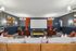 Luxurious home theater room featuring a large projection screen, plush seating, and elegant lighting, perfect for ultimate movie nights.