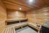 Luxurious wooden sauna with warm lighting offering a serene and relaxing escape.