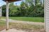 Inviting view from a cozy patio overlooking lush greenery, ideal for relaxation and enjoying nature.