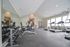 Modern fitness center with state-of-the-art equipment, mirrored walls, and abundant natural light for an invigorating workout experience.
