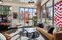 Modern, inviting apartment lobby with stylish furniture, chic decor, and floor-to-ceiling windows showcasing vibrant city views.