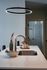 Elegant kitchen island with modern faucet, stylish pendant lighting, and chic decor accents for a sophisticated living space.