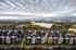 Charming residential area with modern townhouses, vibrant autumn foliage, and a stunning mountain backdrop. Ideal for nature lovers seeking a tranquil yet scenic living environment.