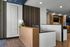 Modern lobby interior featuring stylish wood paneling, elegant seating area, and contemporary lighting.