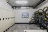 Modern storage room featuring secure lockers and a convenient bike rack, ideal for active lifestyles.