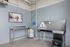 Modern pet washing station in an apartment building, featuring a sleek stainless-steel sink and cheerful dog-themed artwork for a welcoming touch.