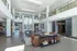 Luxurious modern apartment lobby with high ceilings, elegant seating area, and stylish decor creating an inviting ambiance.