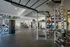 Modern fitness center with state-of-the-art equipment, including treadmills, elliptical machines, and strength training stations.