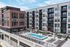 Contemporary apartment complex with vibrant pool area, sun loungers, and modern architecture, offering an inviting outdoor social space.