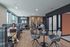 Modern shared workspace with comfortable seating, large windows, and a relaxed atmosphere for productivity.