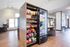 Modern apartment lounge with a snack and drink vending area, cozy seating, and stylish hardwood floors.