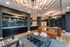 Contemporary lounge area with chic furniture, modern lighting, and a stylish accent wall, perfect for social gatherings and relaxation.