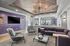 Modern apartment lounge with stylish purple accents, plush seating, and sleek decor for a sophisticated living experience.