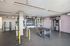 Modern fitness center equipped with diverse exercise machines, free weights, and functional training gear, perfect for an energizing workout.