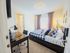 Inviting bedroom with a plush bed, elegant desk, and cozy lighting, perfect for relaxation and productivity.