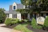 Charming Oxford West apartment exterior with lush landscaping, welcoming entrance, and classic architecture.