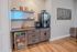 Chic refreshment station featuring modern cabinetry, a variety of beverages, and a charming neon 'coffee sleep repeat' sign.