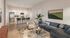 Modern open-concept living space with a stylish kitchen, cozy seating, and elegant decor.