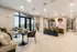 Welcoming modern apartment lobby featuring stylish seating, sleek lighting, and vibrant greenery at Trailhead Vista.