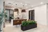 Modern and inviting office reception area at Trailhead Vista, featuring stylish pendant lighting, contemporary furniture, and lush greenery for a welcoming ambiance.