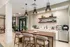 Modern apartment kitchen with sleek countertops, stylish pendant lights, and a cozy breakfast bar. Elegant design and natural lighting create a welcoming atmosphere.