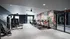 Bright and modern gym with state-of-the-art equipment and vibrant wall art.