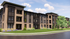 Elegant modern apartment complex with sleek brick facade, lush landscaping, and vibrant green lawn, promising luxurious living.