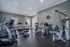 Modern fitness center with state-of-the-art cardio machines and weight training equipment, ideal for an active lifestyle.