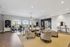 Elegant, spacious living area with modern decor, featuring comfortable seating and large windows overlooking outdoor space.